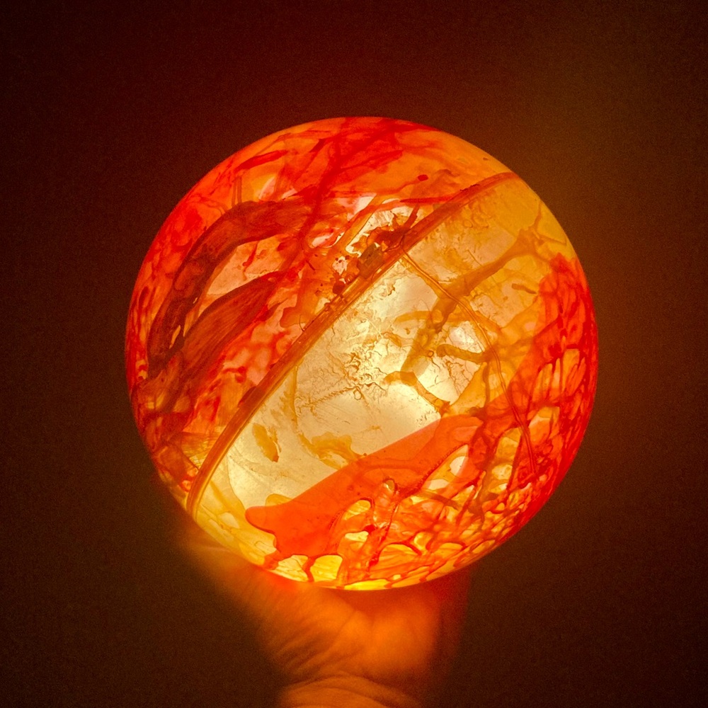 Glowing Orange Orb T Swift Eras Concert Willow